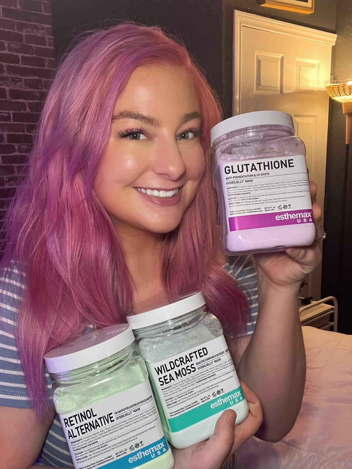 Photo of Salena holding her favorite Esthemax products